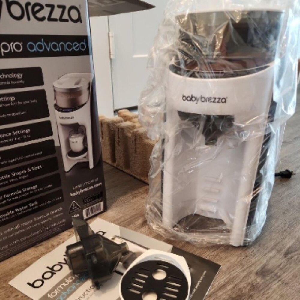 Baby Brezza Formula Pro Advanced Formula Dispenser Machine with an extra funnel